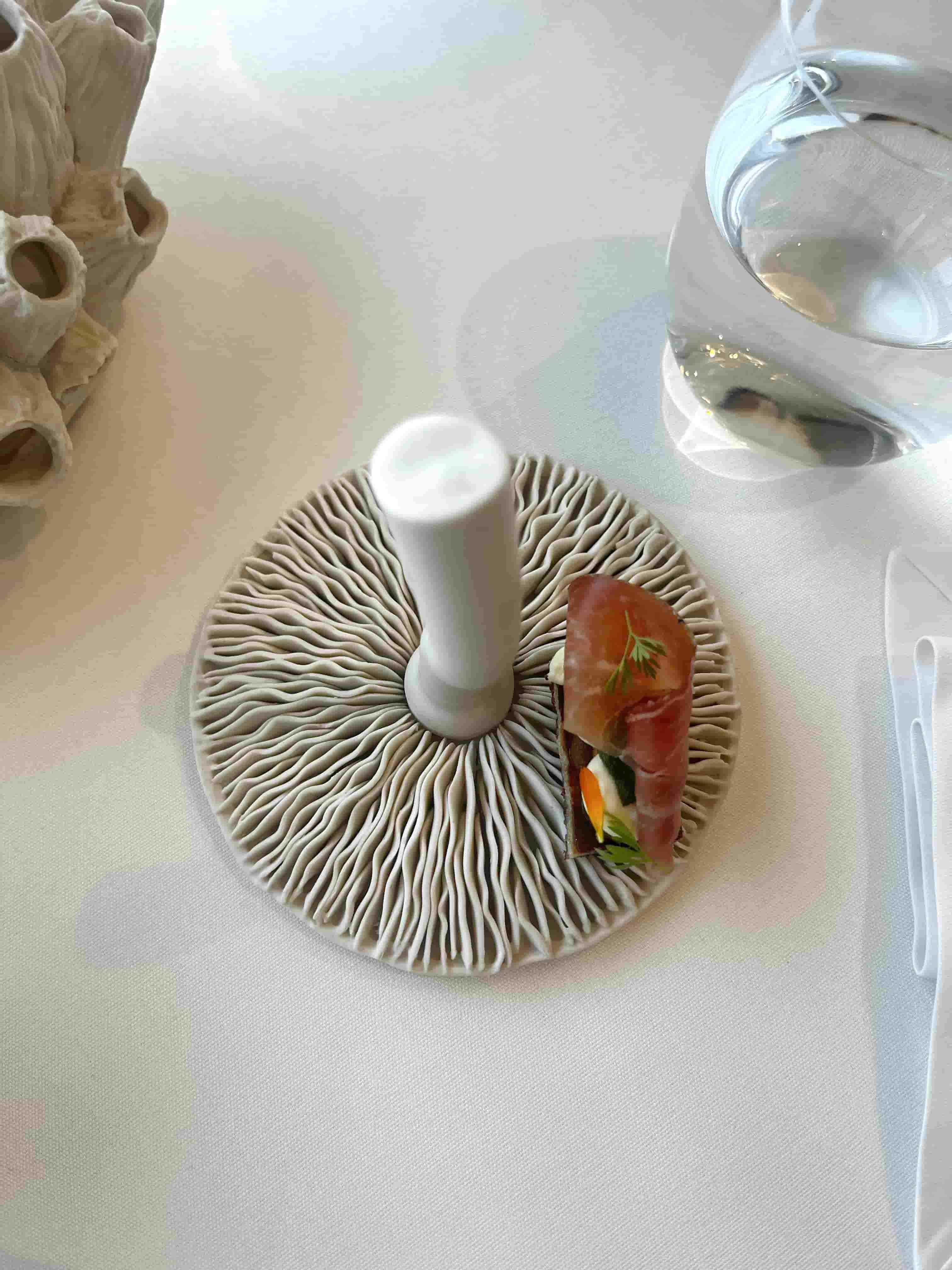 Amuse-bouche served on dinnerware inspired by the sea