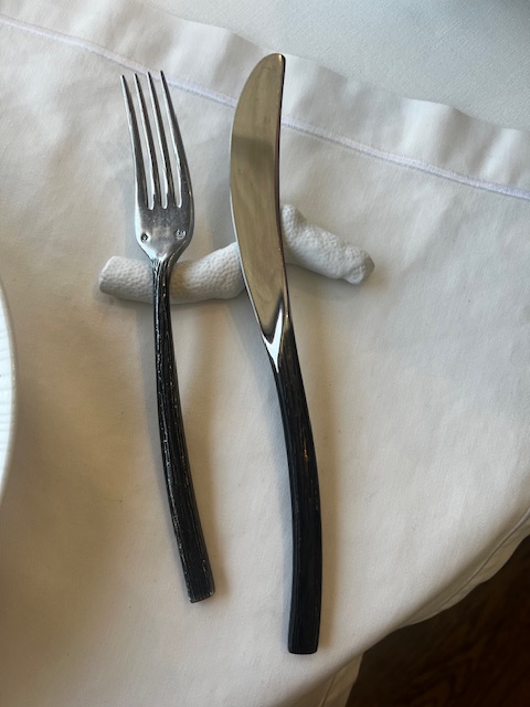 Cutlery resting on coral