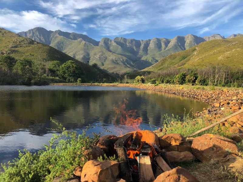 Landscape surrounds of lake with fire and mountains