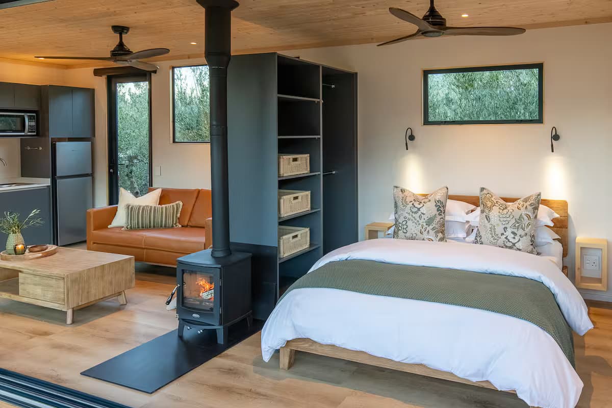 Open plan unit with bedroom, fireplace, living room and kitchen